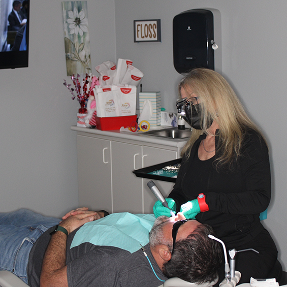 Dentist examining a patient's teeth