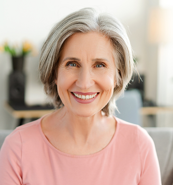 Older woman smiling with dental implants in Lucas