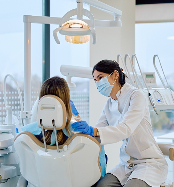 Dentist talking to a patient about full mouth rehabilitation in Lucas