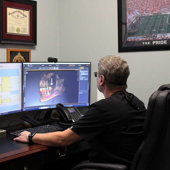 Doctor Hubler looking at digital models of a patient's teeth and jaws
