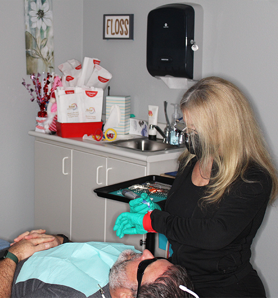 Lucas Family Dentistry team member treating a patient
