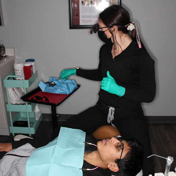 Dental professional treating a patient