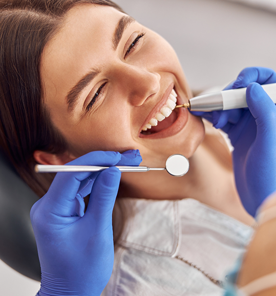Young woman grinning during a preventive dentistry checkup