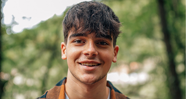 Smiling young man with dark hair