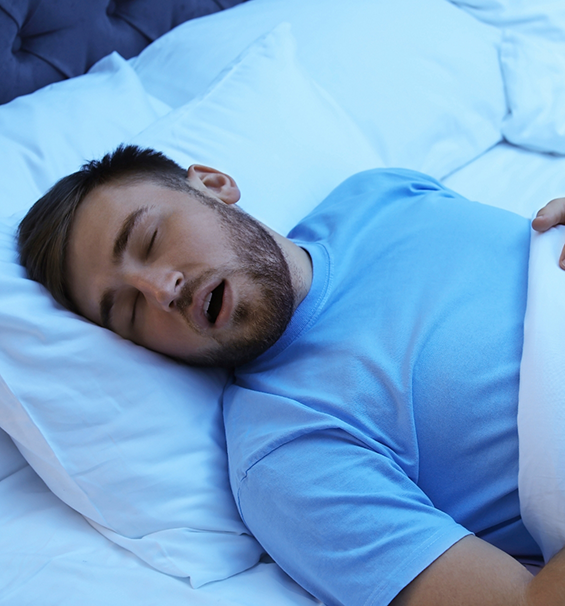 Man sleeping on his back with his mouth open