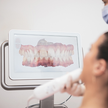 Dentist scanning a patient's teeth